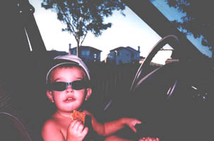 young boy driving a car